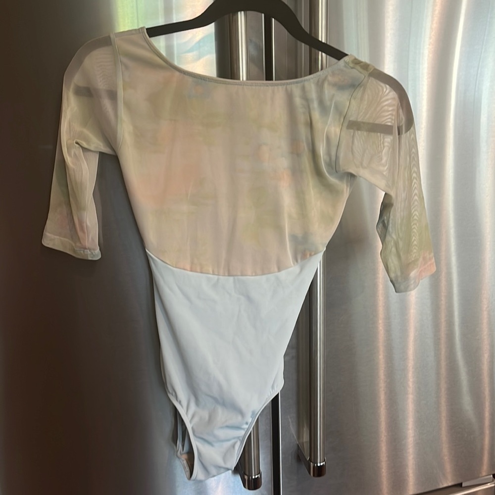 Light blue Eleve with very muted pattern on top and mesh sleeves.